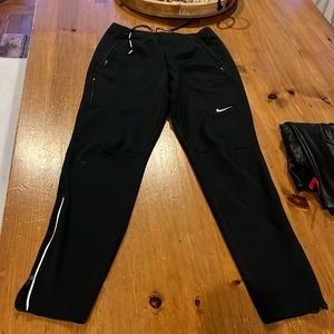 Nike Dri Fit size small. In worn condition. Bottom rt.leg has a sm faded stain